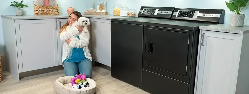 speed-queen-tr7-woman-holding-dog-hero